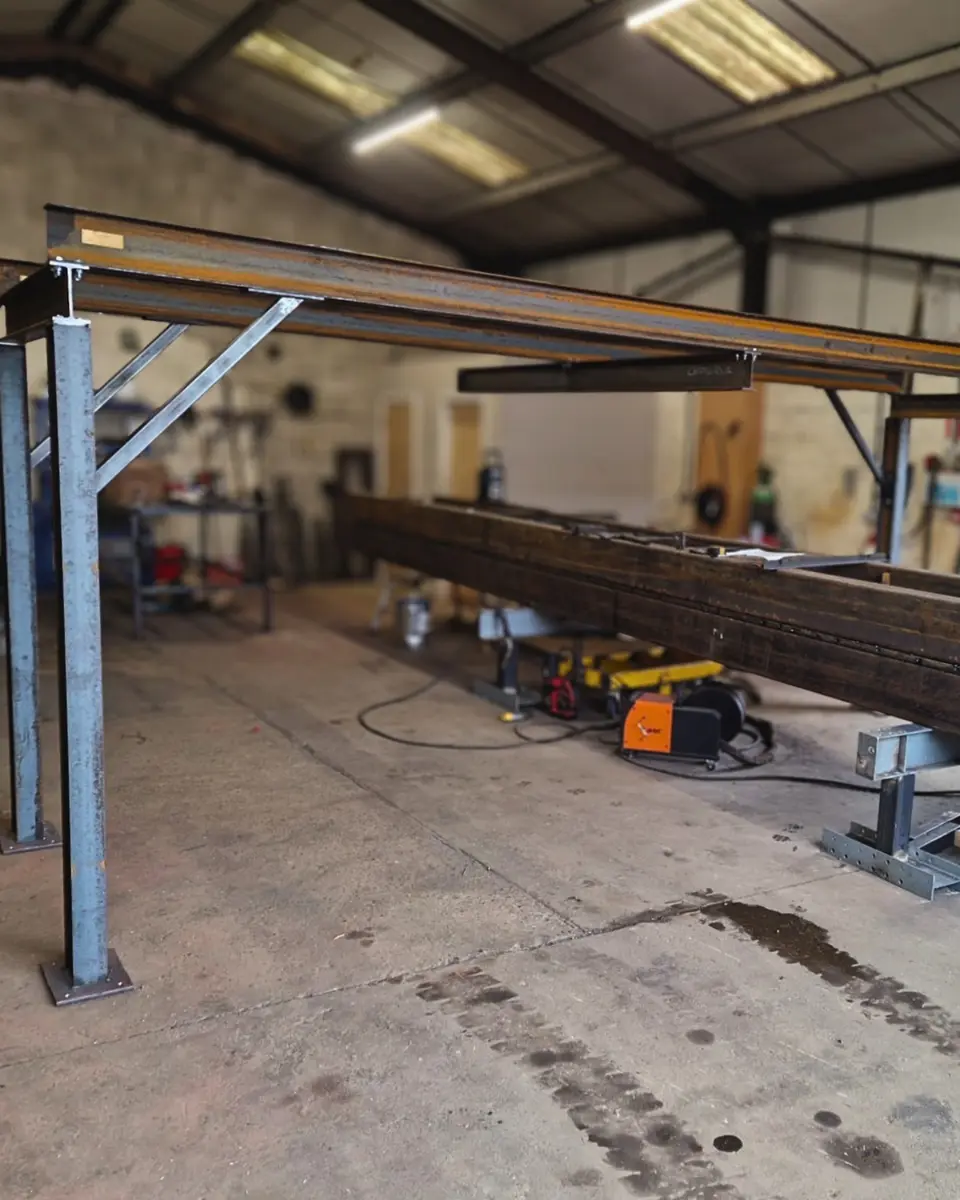 Full view of a large steel frame fabricated in the Cerberus workshop