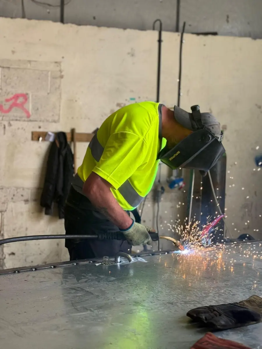 Fabricator welding steel