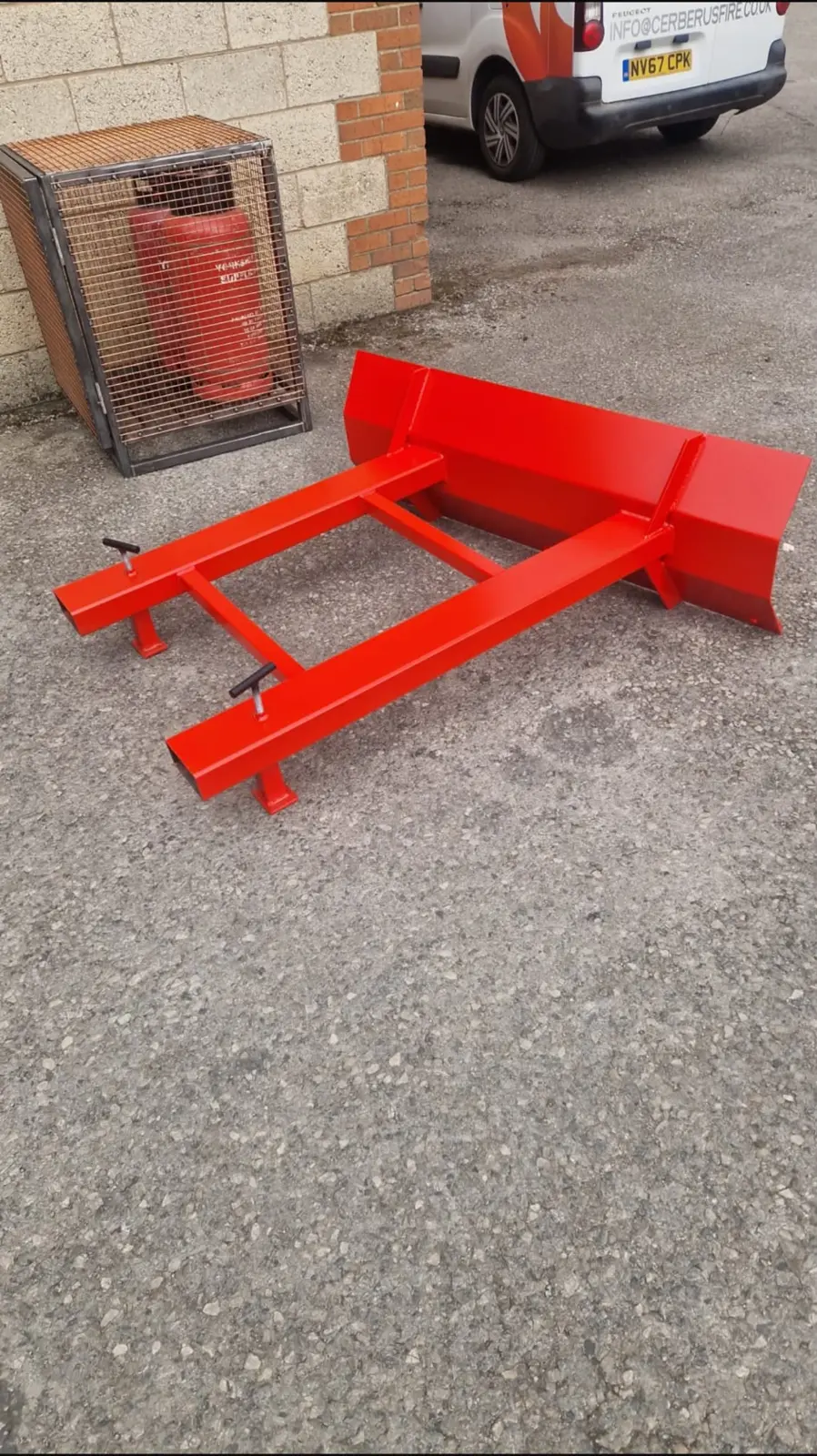 Red fabricated steel loading attachment