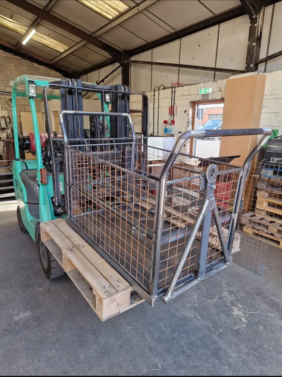 Fabricated material-handling cage mounted on a forklift
